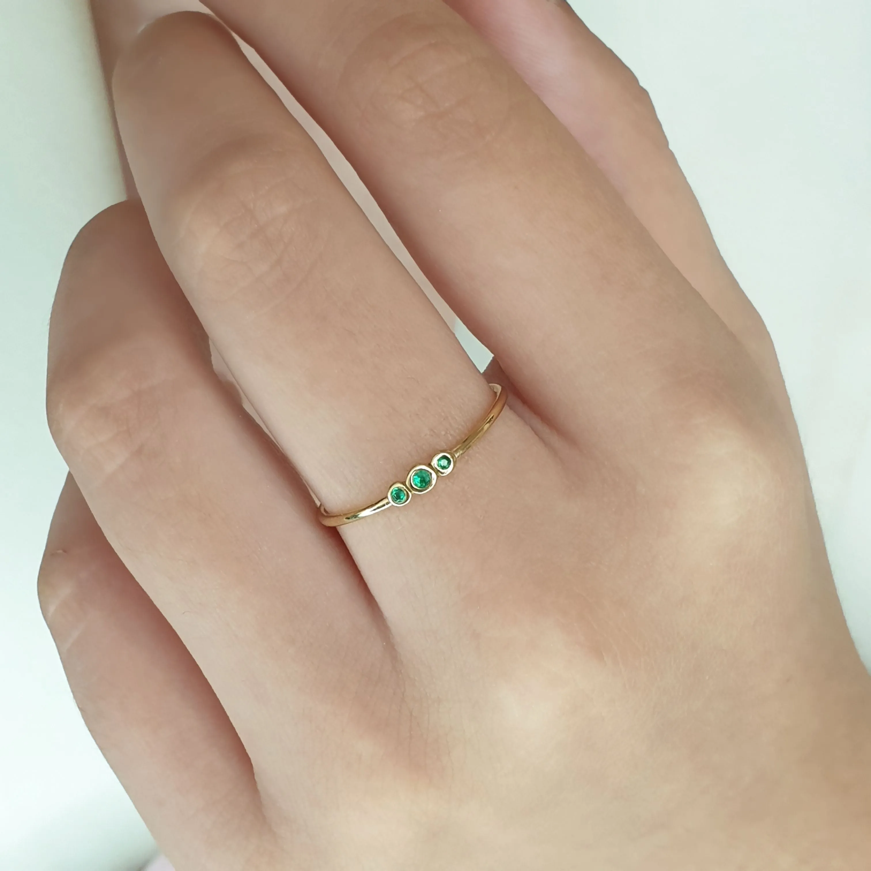 3 emerald ring gold